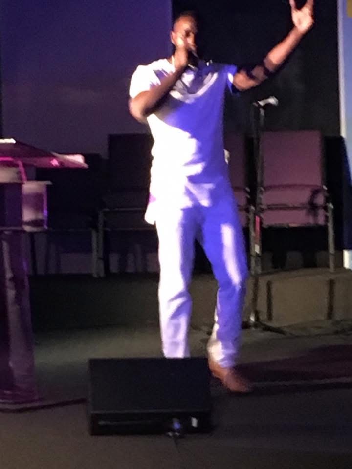 Brandon on stage mid-message